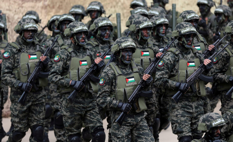 FILE PHOTO: Palestinian Hamas militants take part in a rally marking the 31st anniversary of Hamas' founding, in Gaza City